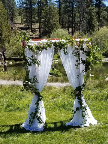 Floral Silks with Greenery Garland and Fabric Arbor Decor