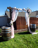 Wedding Arbor With 2 Barrels and Pink White Chiffon Fabric